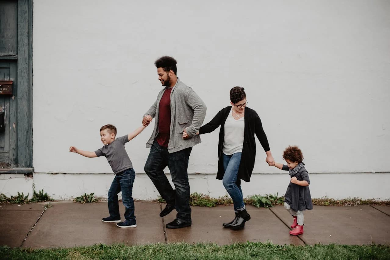 A family walking together, holding hands